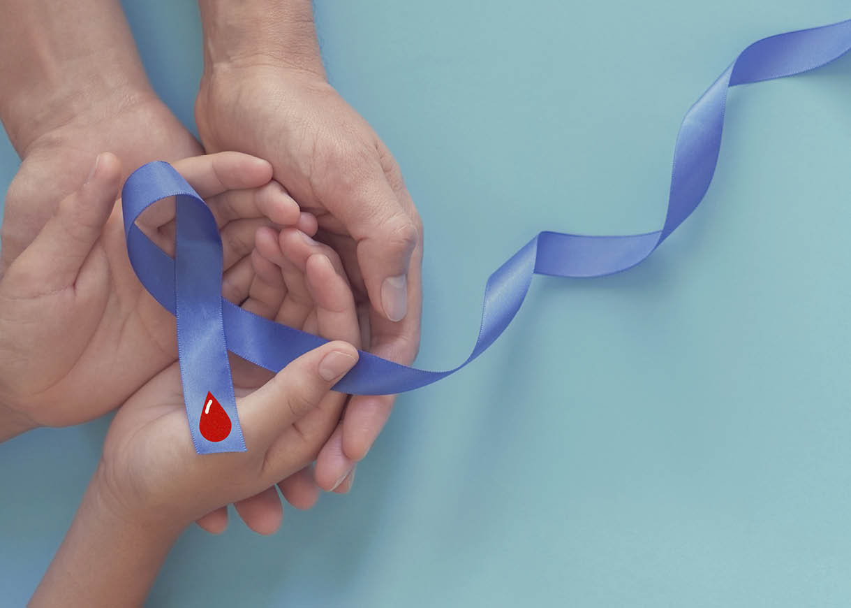 adult and child hands holding Blue ribbon with red blood, world diabetes day